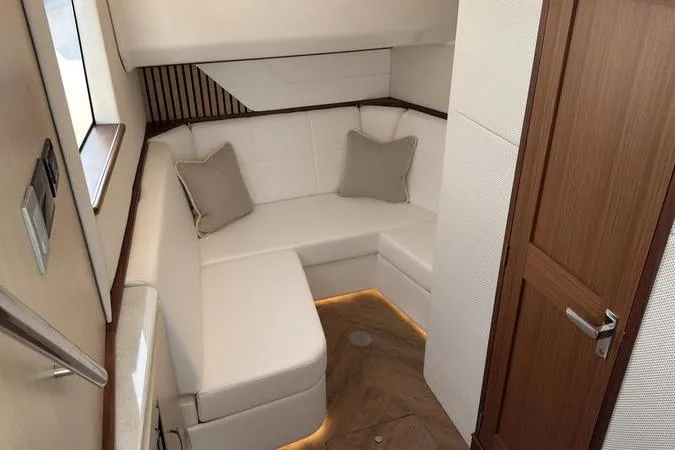 Slide: The Image of Luxurious interior of 2025 Regal LX43 yacht with white seating and wooden accents. - 72