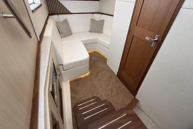 Slide: The Image of Luxurious interior of 2025 Regal LX43 yacht with elegant seating and wooden accents. - 73