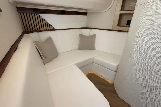 Slide: The Image of Luxurious interior of 2025 Regal LX43 yacht with white seating and cushions. - 75