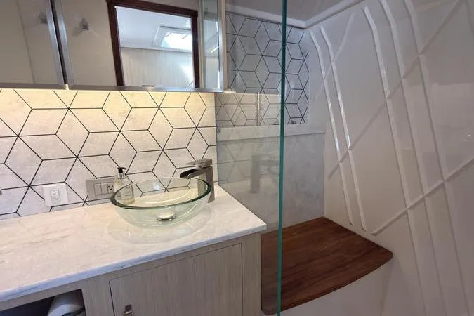 Slide: The Image of Modern bathroom in 2025 Regal LX43 yacht with glass sink and geometric tiles. - 79
