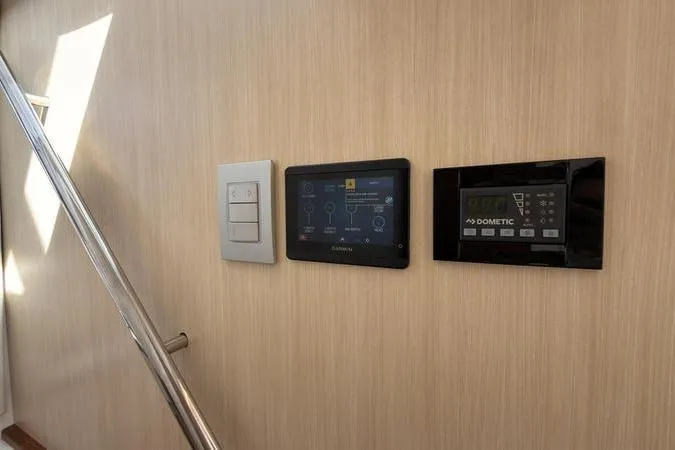 Slide: The Image of Control panel and switches on 2025 Regal LX43 yacht interior wall. - 82