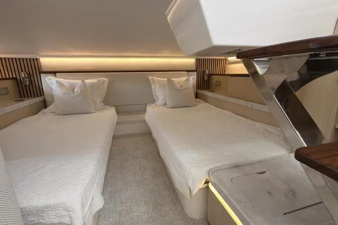 Slide: The Image of Luxurious twin cabin interior of 2025 Regal LX43 yacht with modern design. - 83