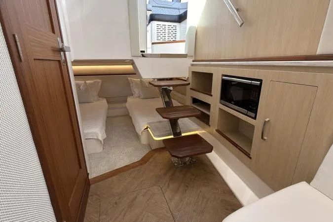 Slide: The Image of Luxurious interior of 2025 Regal LX43 yacht with modern amenities and elegant design. - 87
