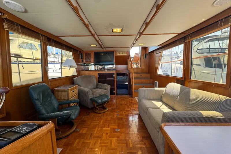 Slide: The Image of Luxurious interior of 1987 Lien Hwa 47 Cockpit Motoryacht with comfortable seating and wood finishes. - 11