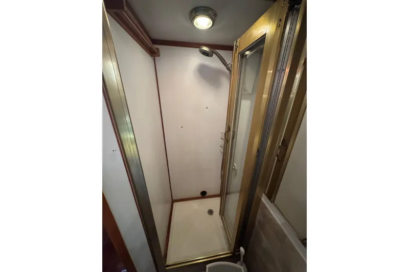 Slide: The Image of Shower area in 1987 Lien Hwa 47 Cockpit Motoryacht, featuring glass door and overhead light. - 20