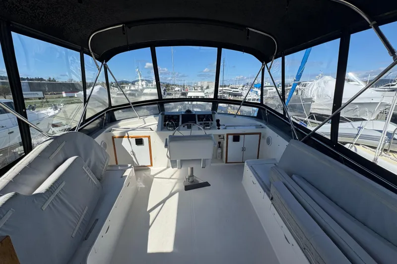 Slide: The Image of 1987 Lien Hwa 47 Cockpit Motoryacht interior with helm and seating area. - 24