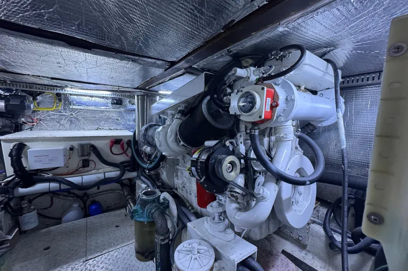 Slide: The Image of Engine room of 1987 Lien Hwa 47 Cockpit Motoryacht, showcasing mechanical components and insulation. - 29