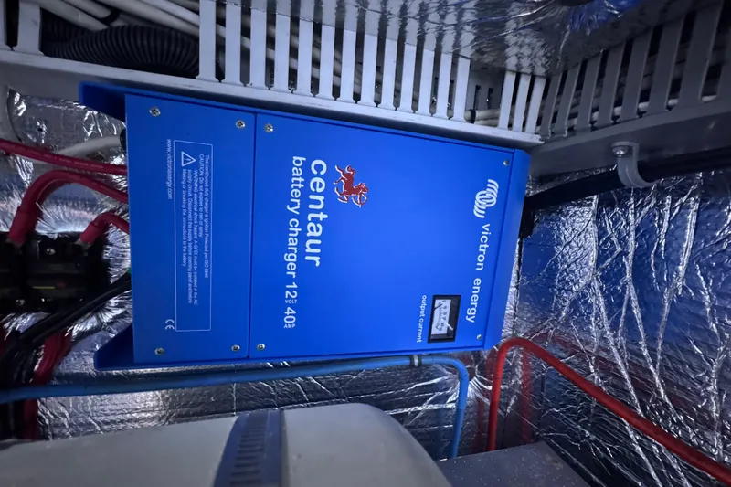 Slide: The Image of Blue Victron Energy Centaur battery charger in 1987 Lien Hwa 47 Cockpit Motoryacht engine room. - 32