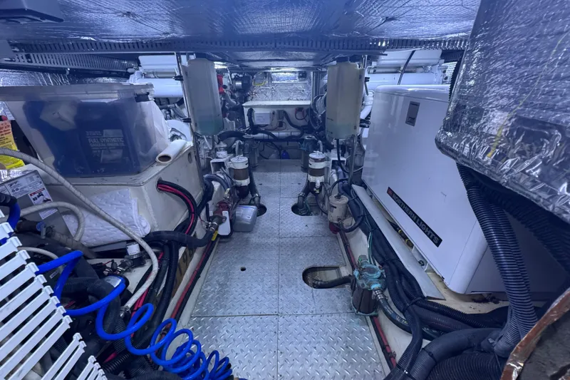 Slide: The Image of Engine room of 1987 Lien Hwa 47 Cockpit Motoryacht, showcasing mechanical components and wiring. - 34