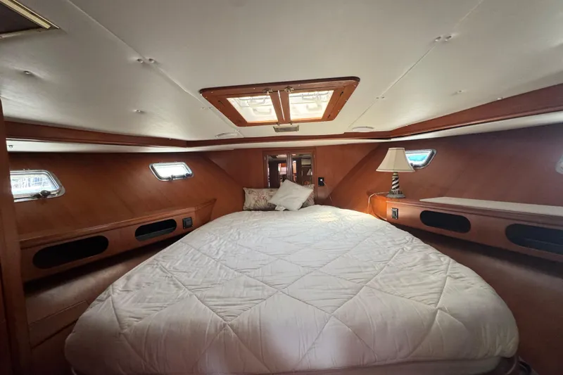 Slide: The Image of Luxurious cabin interior of 1987 Lien Hwa 47 Cockpit Motoryacht with cozy bed and wooden finish. - 4