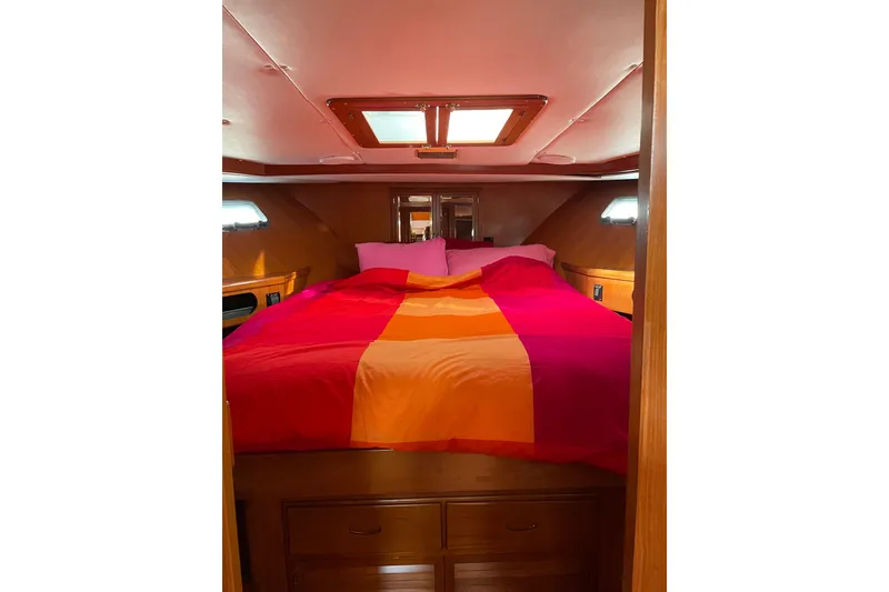 Slide: The Image of Cozy bedroom in 1987 Lien Hwa 47 Cockpit Motoryacht with vibrant bedding. - 6