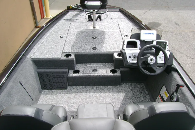 Slide: The Image of 2026 Tracker Pro Team 195 boat interior with steering console and seating. - 5