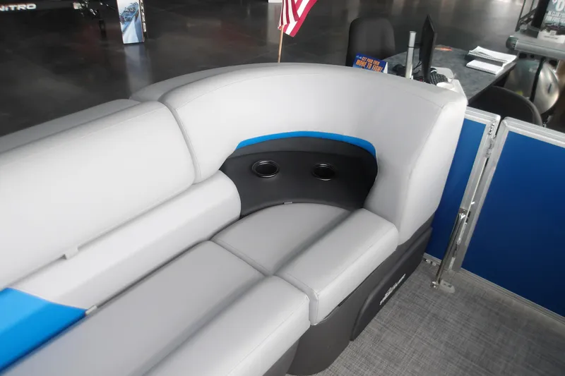 Slide: The Image of 2026 Sun Tracker Party Barge 20 DLX interior seating with cup holders and modern design. - 15