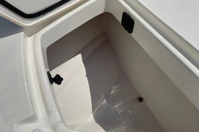 Slide: The Image of Storage compartment of 2026 Mako 18 Pro Skiff boat, showcasing interior space and design. - 16