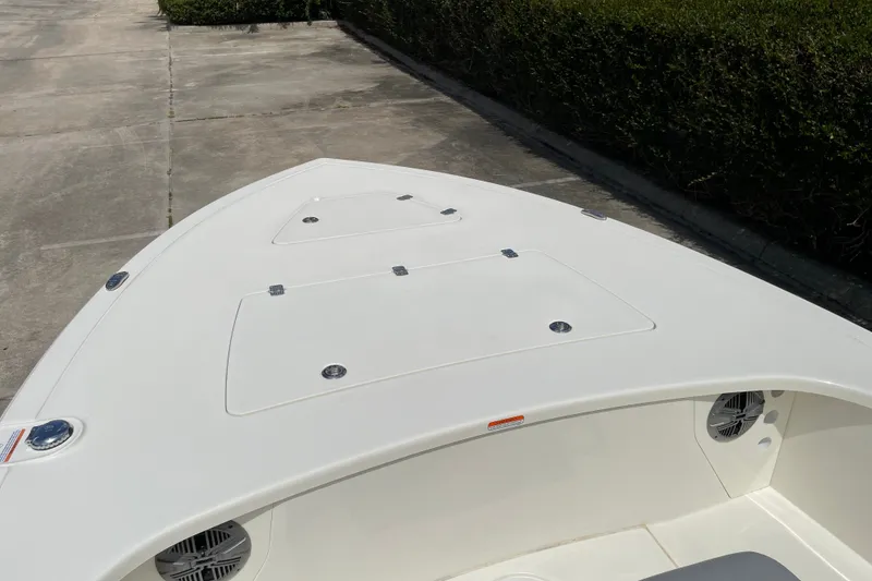 Slide: The Image of 2026 Mako 18 Pro Skiff boat deck, featuring storage compartments and sleek design. - 14