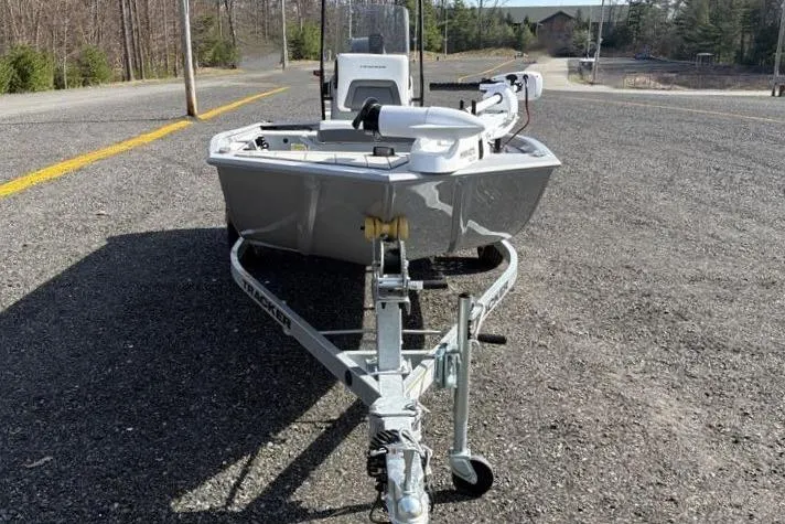 Slide: The Image of 2026 Tracker Bass Tracker Classic CC boat on trailer, parked on asphalt road. - 6