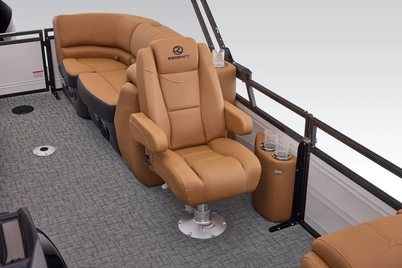 Slide: The Image of Luxurious seating on 2026 Regency 230 DL boat with tan upholstery and cup holders. - 31