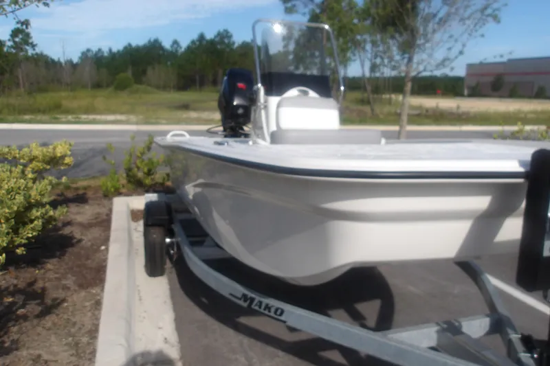 Slide: The Image of 2026 Mako Pro Skiff 13 CC boat on trailer in outdoor setting. - 14