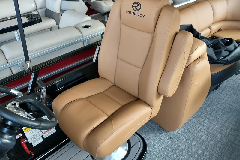 Slide: The Image of Luxurious tan seating in 2026 Regency 230 DL boat interior. - 4