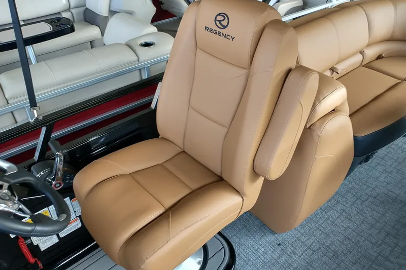 Slide: The Image of Luxurious tan seating in 2026 Regency 230 DL boat interior. - 5