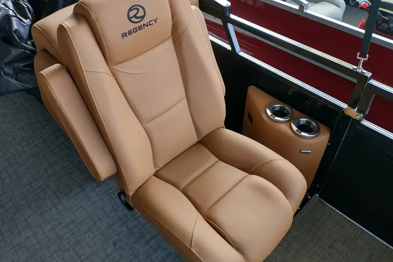 Slide: The Image of Luxurious tan seat in 2026 Regency 230 DL boat with cup holders. - 6