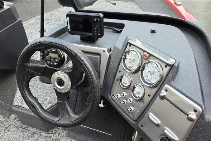 Slide: The Image of Dashboard of 2026 Tracker Pro Guide V-175 Combo boat with steering wheel and gauges. - 10