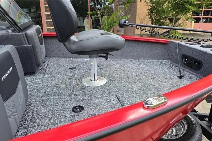 Slide: The Image of 2026 Tracker Pro Guide V-175 Combo boat interior with seating and carpeted deck. - 9