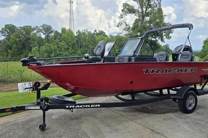 Slide: The Image of 2026 Tracker Pro Guide V-175 Combo boat on trailer, parked outdoors. - 3