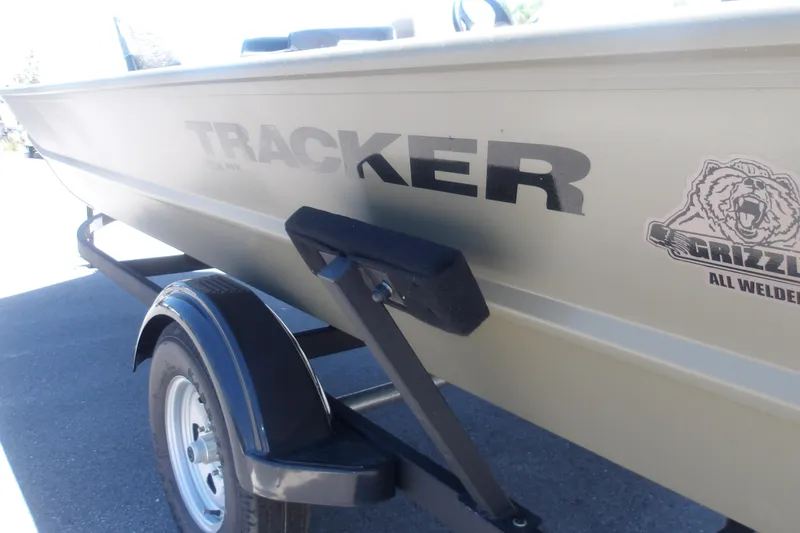 Slide: The Image of 2026 Tracker Grizzly 1754 SC boat on trailer, featuring durable all-welded design. - 8