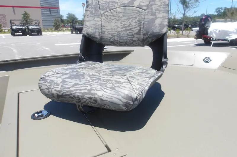 Slide: The Image of Camouflage seat on 2026 Tracker Grizzly 1754 SC boat, parked outdoors. - 12