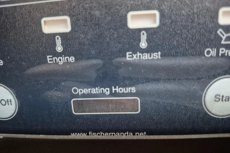 Slide: The Image of Control panel of a 2008 Robalo R305 Walkaround boat, showing engine and exhaust indicators. - 31