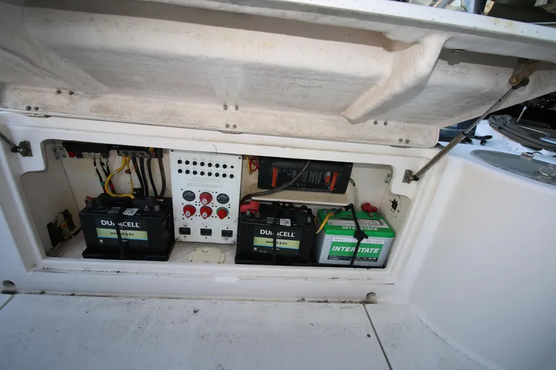 Slide: The Image of 2008 Robalo R305 Walkaround boat battery compartment with Duracell and Interstate batteries. - 16