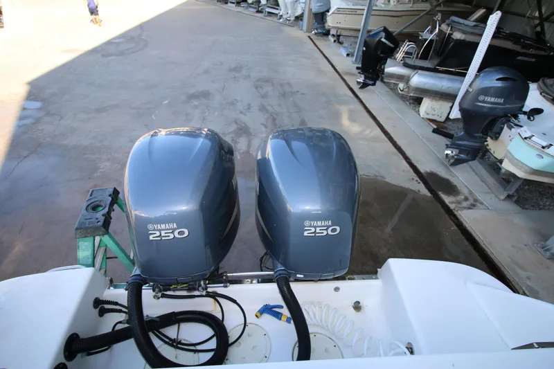 Slide: The Image of Twin Yamaha 250 engines on a 2008 Robalo R305 Walkaround boat. - 17