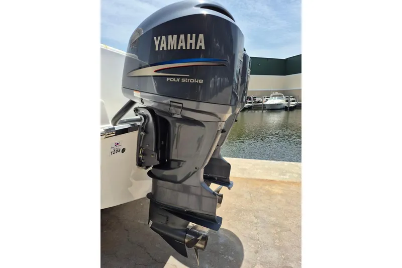 Slide: The Image of Yamaha four-stroke outboard motor on 2008 Robalo R305 Walkaround boat, dockside view. - 4