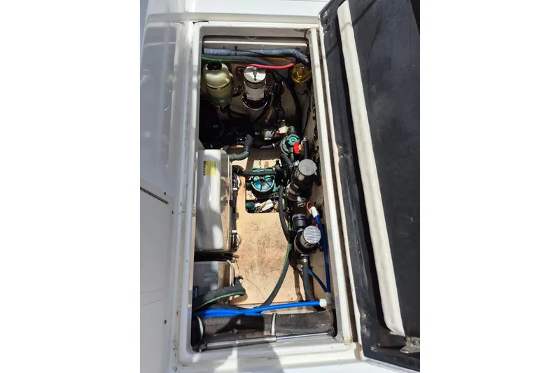 Slide: The Image of Engine compartment of 2008 Robalo R305 Walkaround boat, showcasing mechanical components. - 26