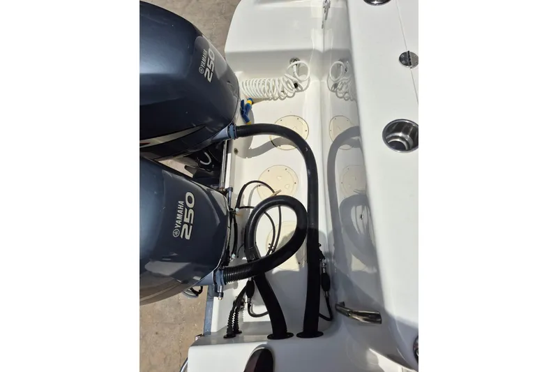Slide: The Image of 2008 Robalo R305 Walkaround with dual Yamaha 250 engines, showcasing the boat's powerful motor setup. - 7