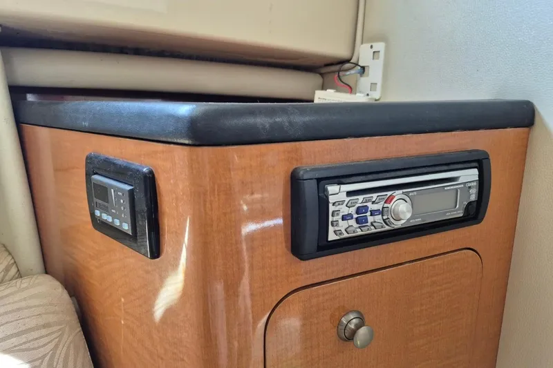 Slide: The Image of 2008 Robalo R305 Walkaround cabin with wood paneling and built-in stereo system. - 20
