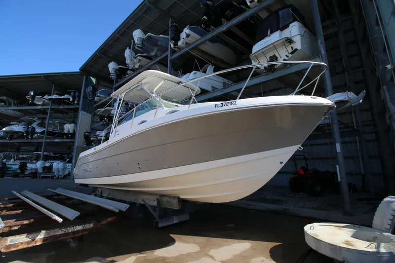 Slide: The Image of 2008 Robalo R305 Walkaround boat in storage facility, elevated on supports. - 5