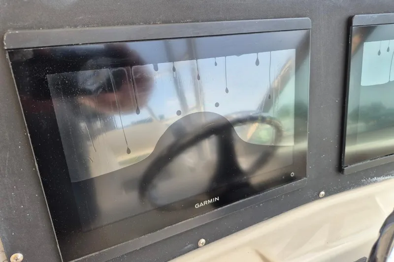 Slide: The Image of Garmin display on 2008 Robalo R305 Walkaround boat, showing water droplets and reflections. - 25