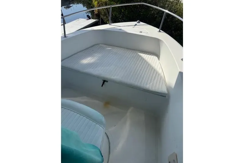 Slide: The Image of 2006 Sea Pro 196 Center Console boat interior with cushioned seating area. - 11