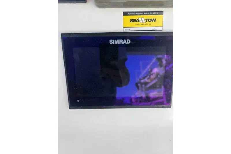 Slide: The Image of Simrad display on 2006 Sea Pro 196 Center Console boat dashboard. - 17