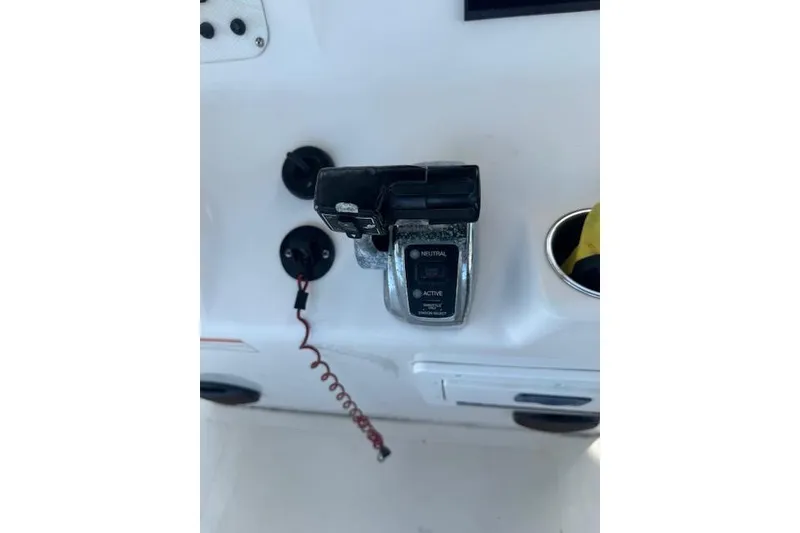 Slide: The Image of 2006 Sea Pro 196 Center Console boat control panel with throttle and ignition. - 18