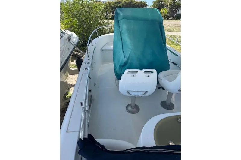 Slide: The Image of 2006 Sea Pro 196 Center Console boat interior with covered console and seating. - 9