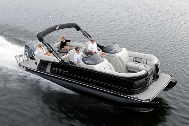 Slide: The Image of Manufacturer Provided Image: Manufacturer Provided Image: 2026 Starcraft RX 23 DL pontoon boat cruising with passengers on a calm lake. - 3