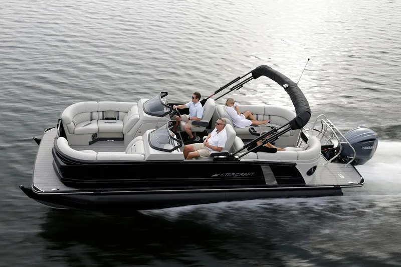 Slide: The Image of Manufacturer Provided Image: Manufacturer Provided Image: 2026 Starcraft RX 23 DL pontoon boat cruising on water with passengers. - 4