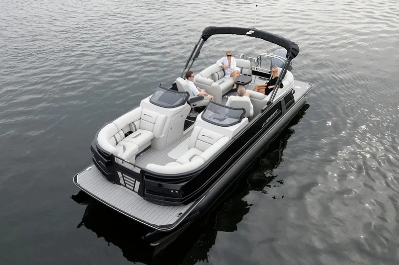 Slide: The Image of Manufacturer Provided Image: Manufacturer Provided Image: 2026 Starcraft RX 23 DL pontoon boat on water with passengers enjoying leisure time. - 6