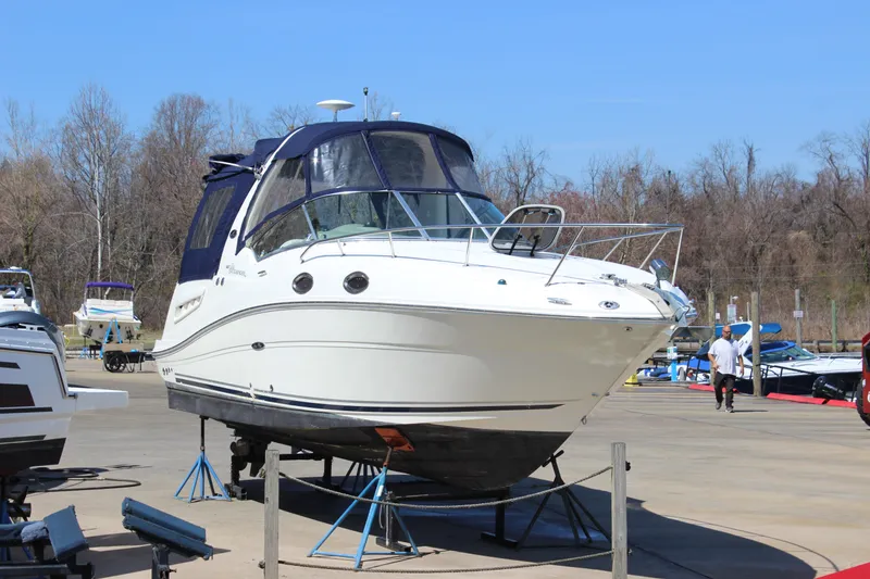 Slide: The Image of 2006 Sea Ray Sundancer 260 boat on stands at a marina. - 10