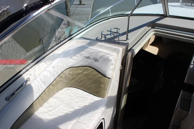 Slide: The Image of 2006 Sea Ray Sundancer 260 interior with seating and cabin entrance. - 21