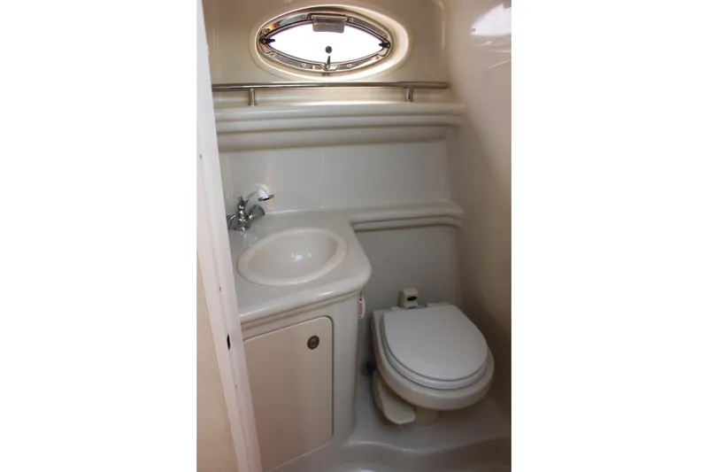 Slide: The Image of Compact bathroom in 2006 Sea Ray Sundancer 260 boat with sink and toilet. - 30