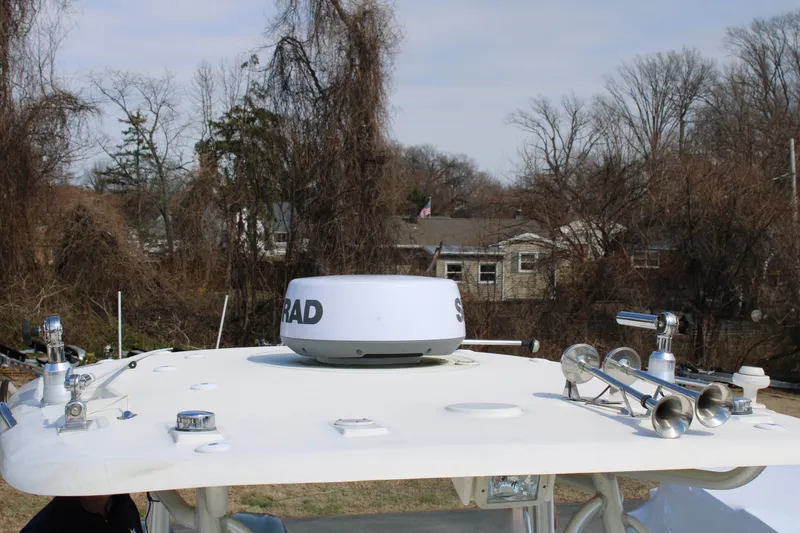Slide: The Image of 2007 Hydra-Sports Vector 2900 CC boat radar and horn setup on deck. - 14